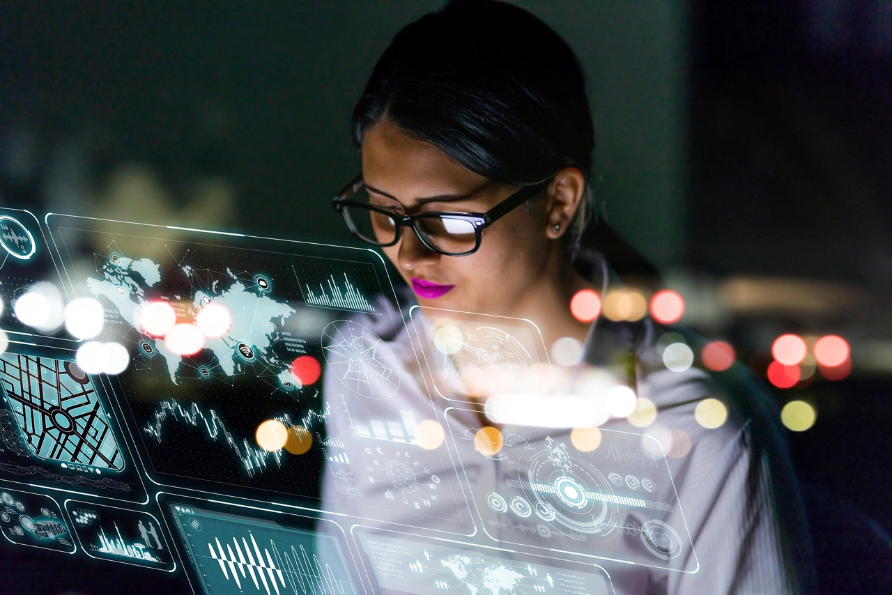 businesswoman looking at futuristic interface screen.