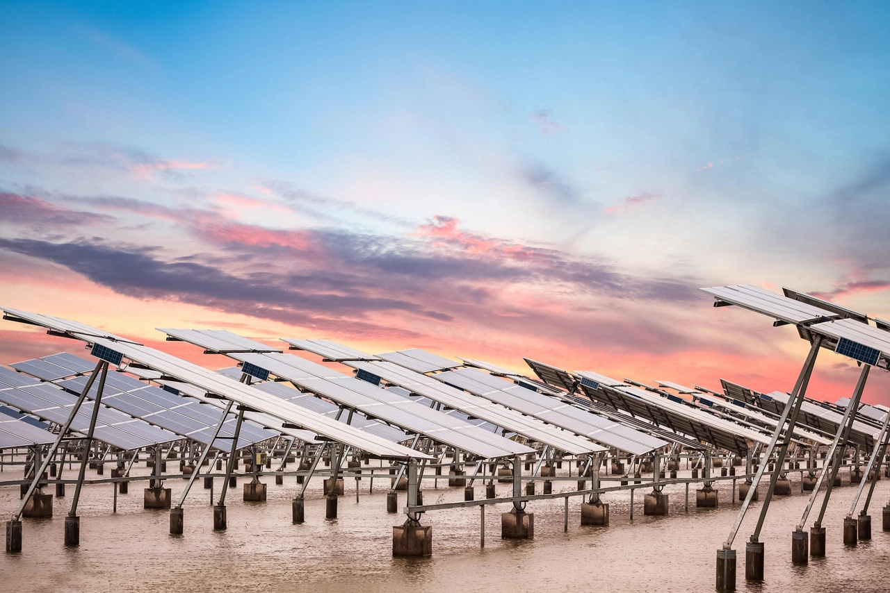 solar power farm in  sunset , develops coastal tidal flats and green energy