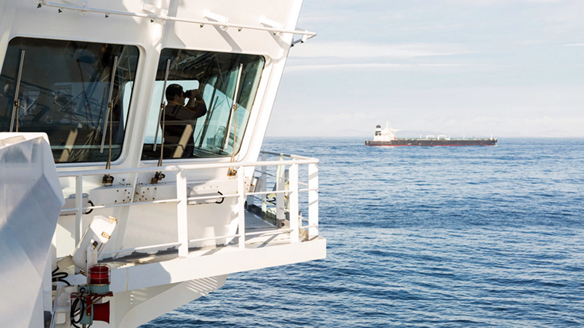 Ship bridge overlooking offshore marine operations