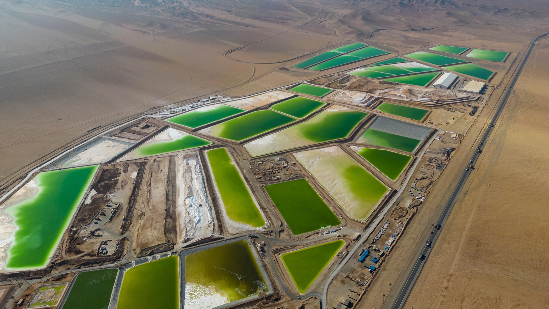 Aerial view of lithium fields or evaporation ponds in the Atacama desert, South America - a surreal, colorful landscape where batteries are born