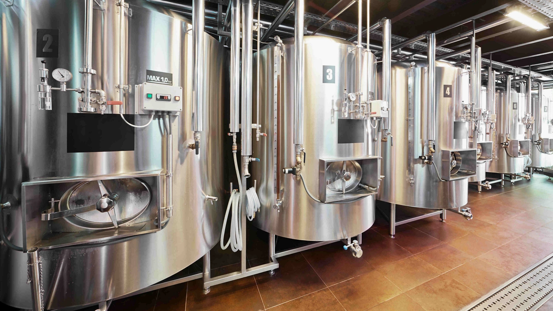 Row of tanks in microbrewery