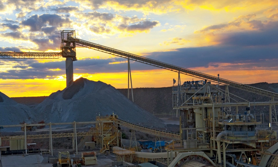 Sunset over mine, red sunset reflecting over the metals of the mine infrastructure Australia.
