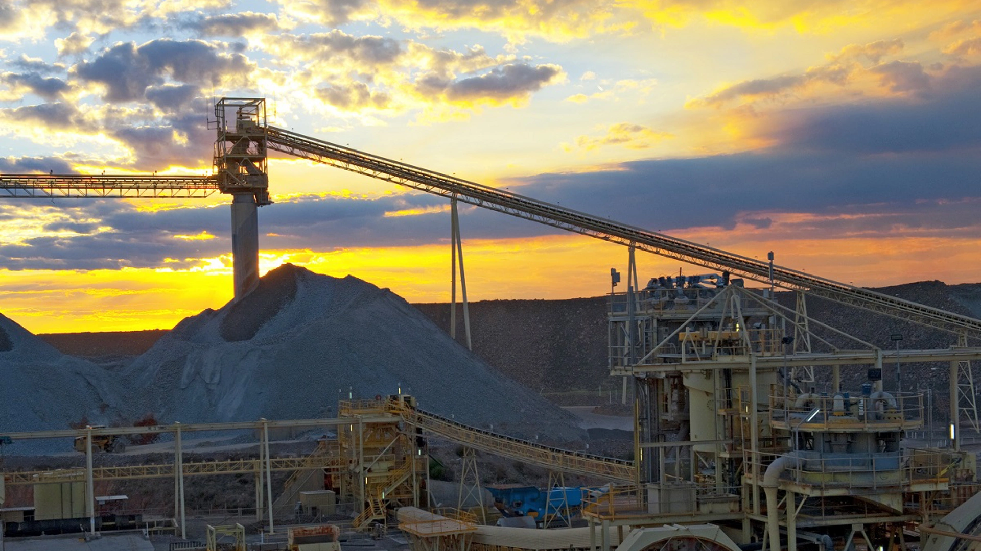 Sunset over mine, red sunset reflecting over the metals of the mine infrastructure Australia.