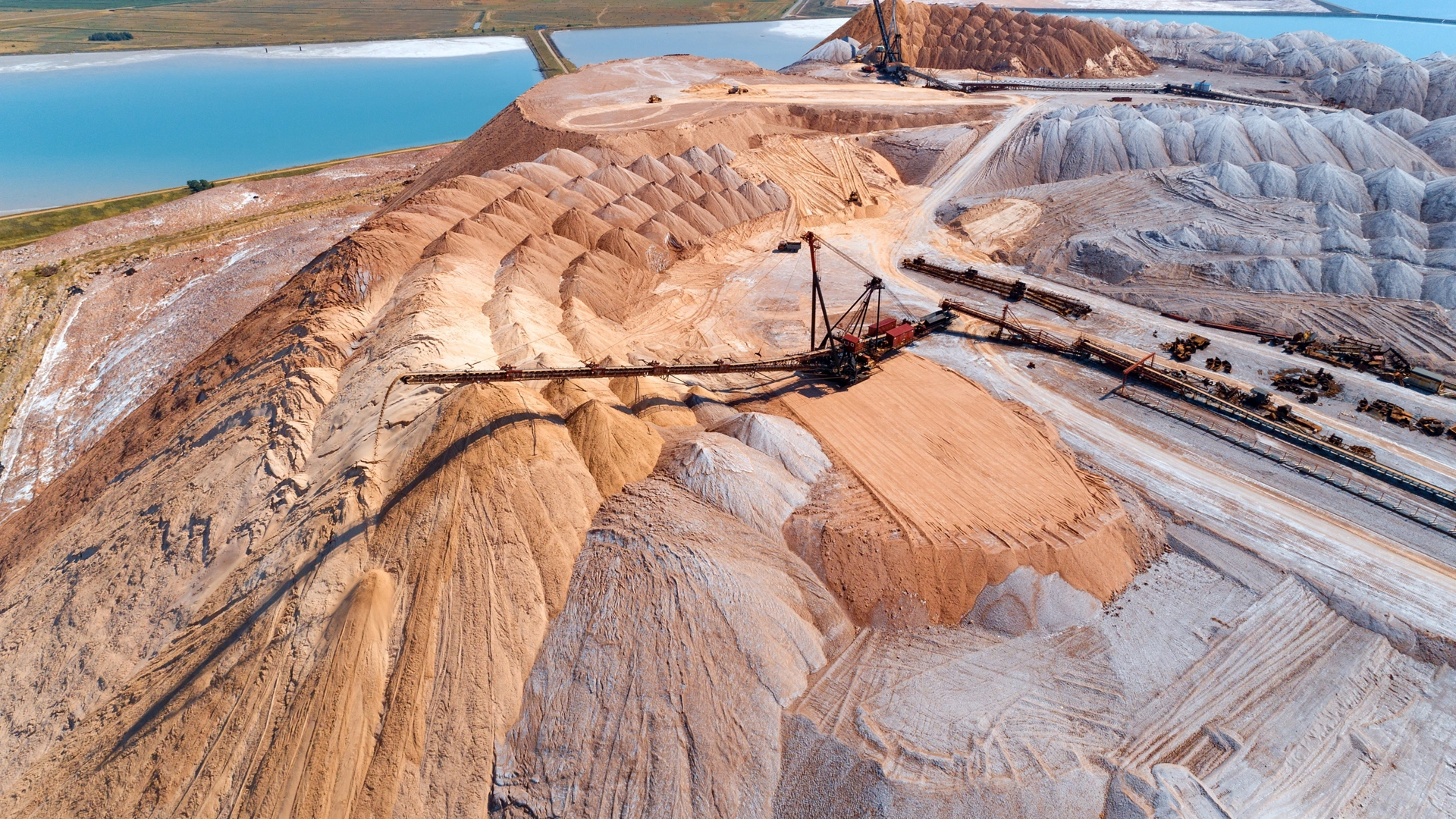 An industrial spreader in the process of work. The process of pouring rock piles.