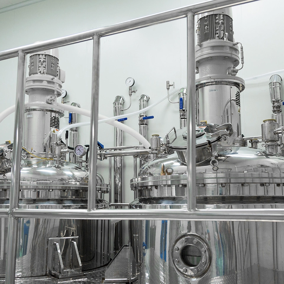 behind pipe bars, two big compression tanks behind pipe bars