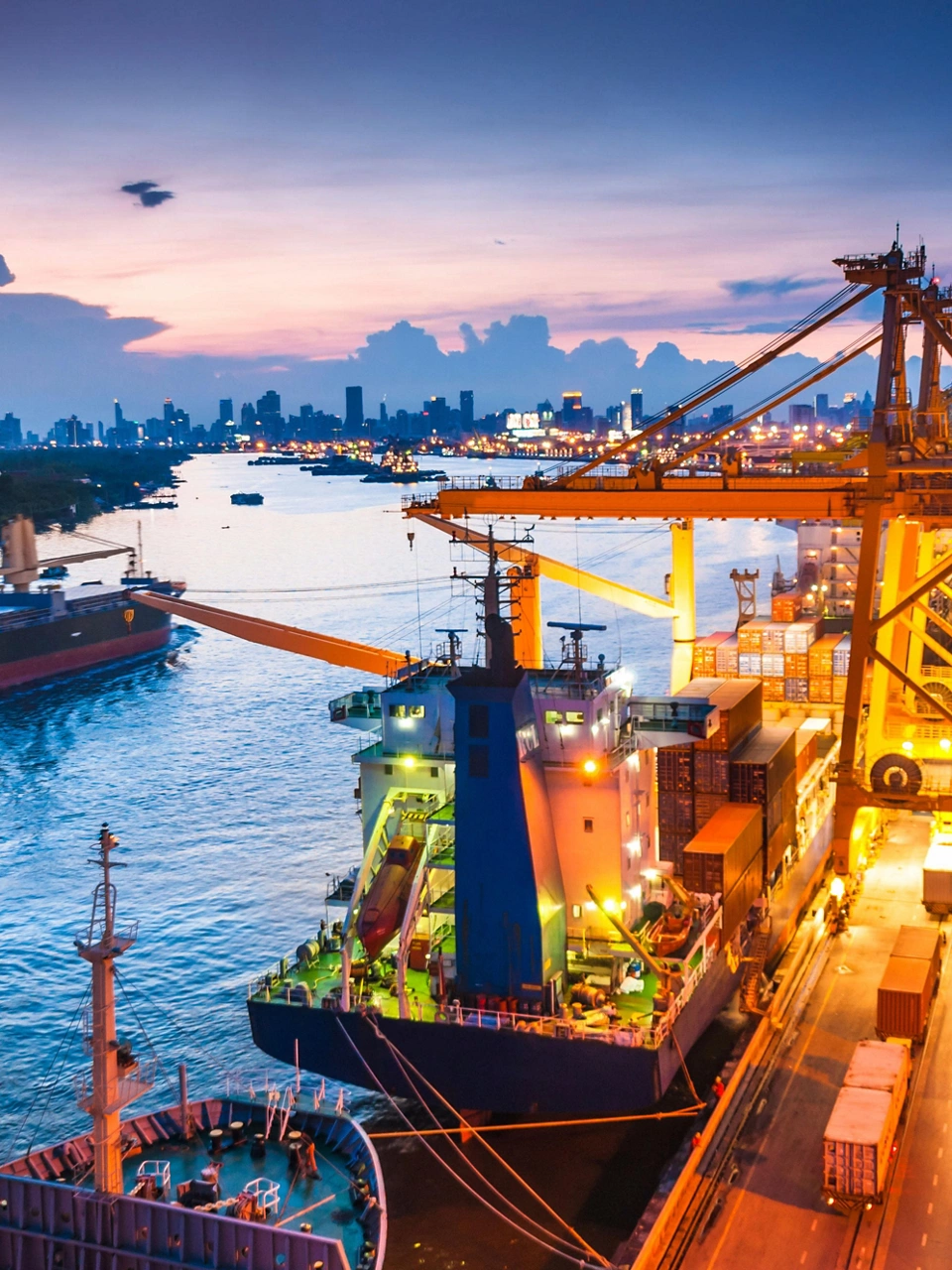 Shipping channel with several tankers at dusk