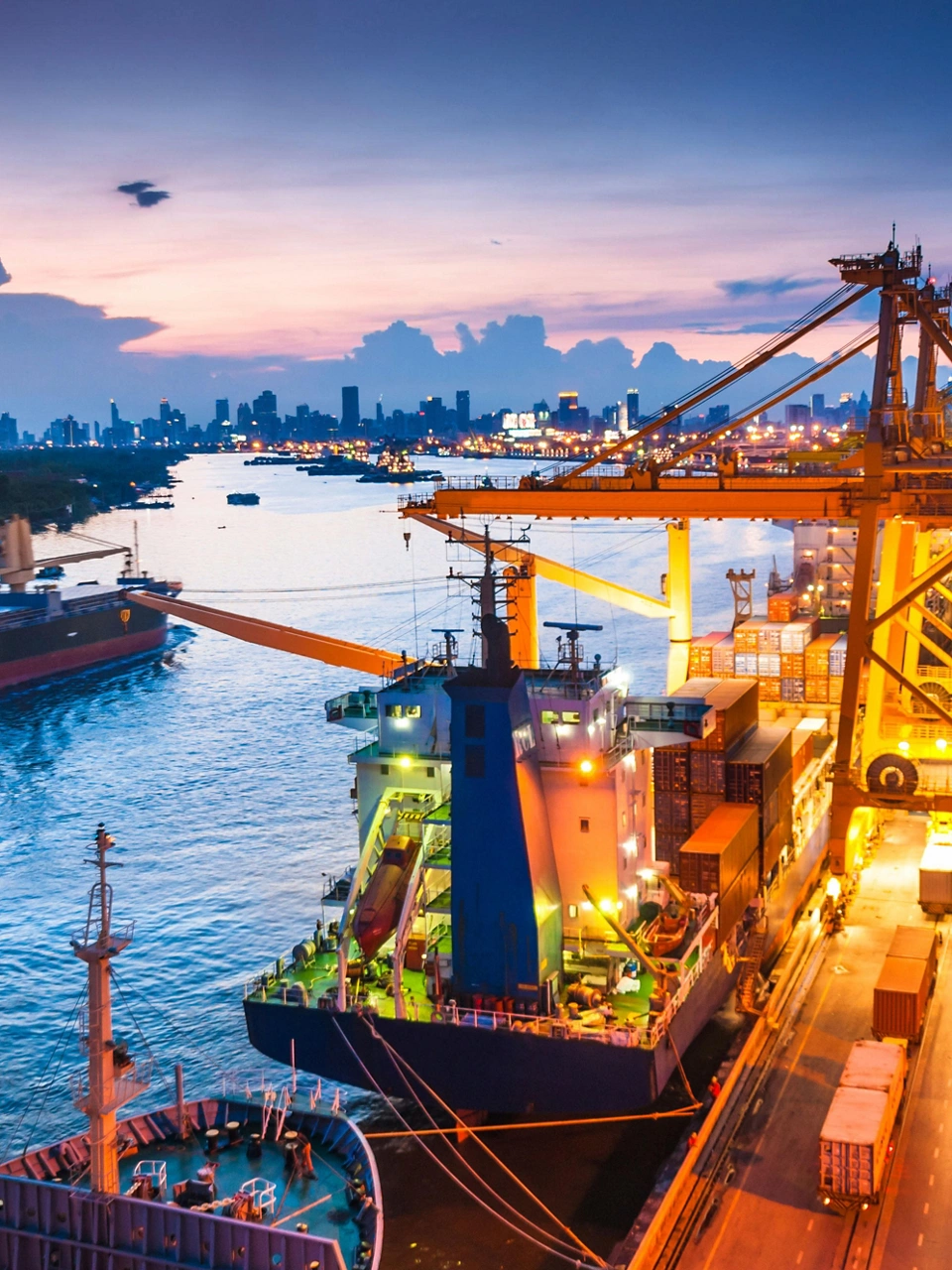 Shipping channel with several tankers at dusk