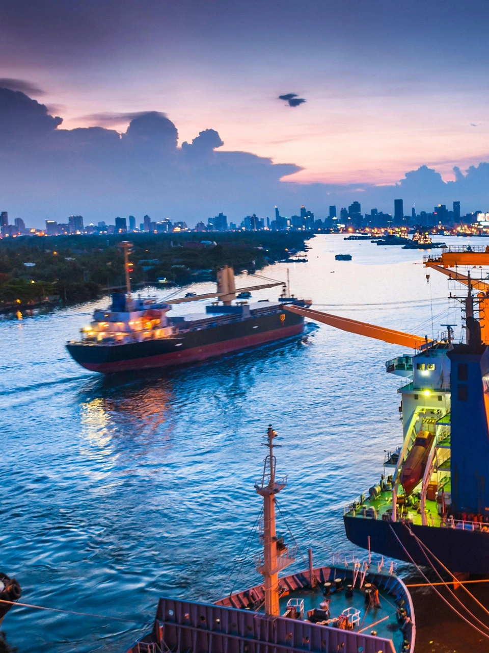 Shipping channel with several tankers at dusk