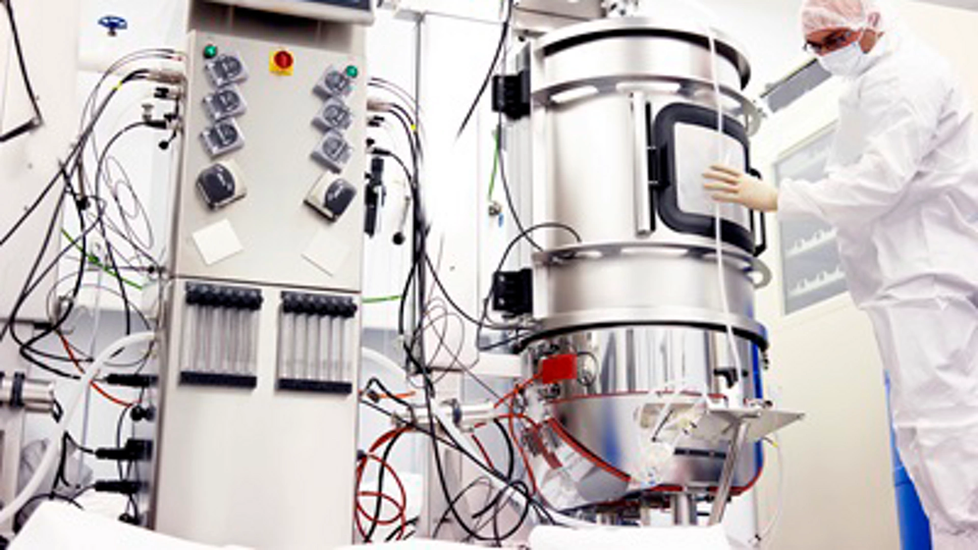 Scientist working with a bioreactor for cell culture