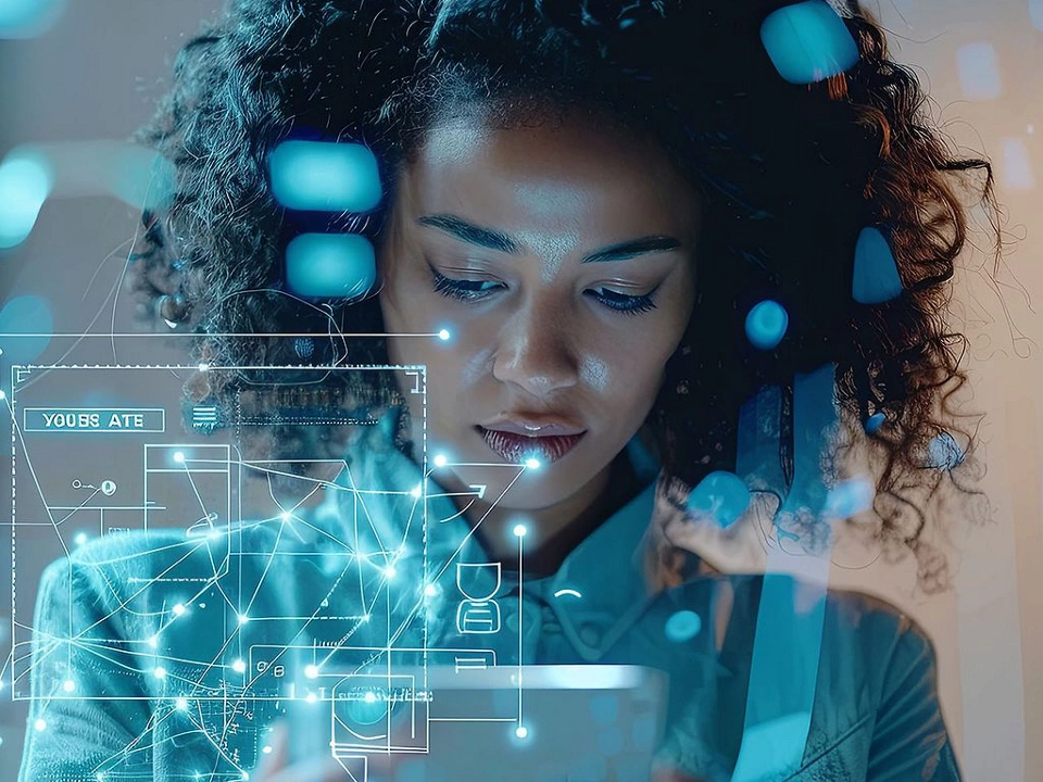 woman working on device with technology overlay