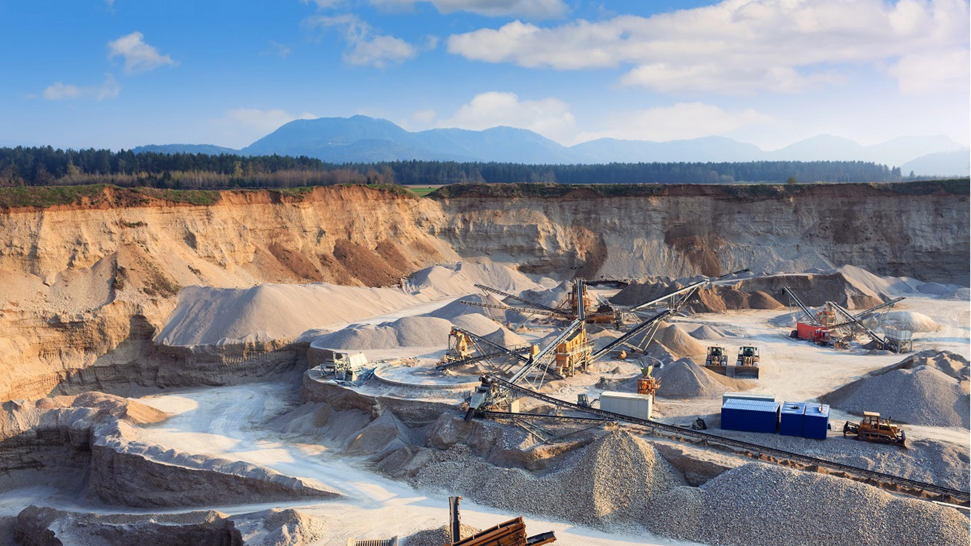 Rock quarry with trucks and all equipment.