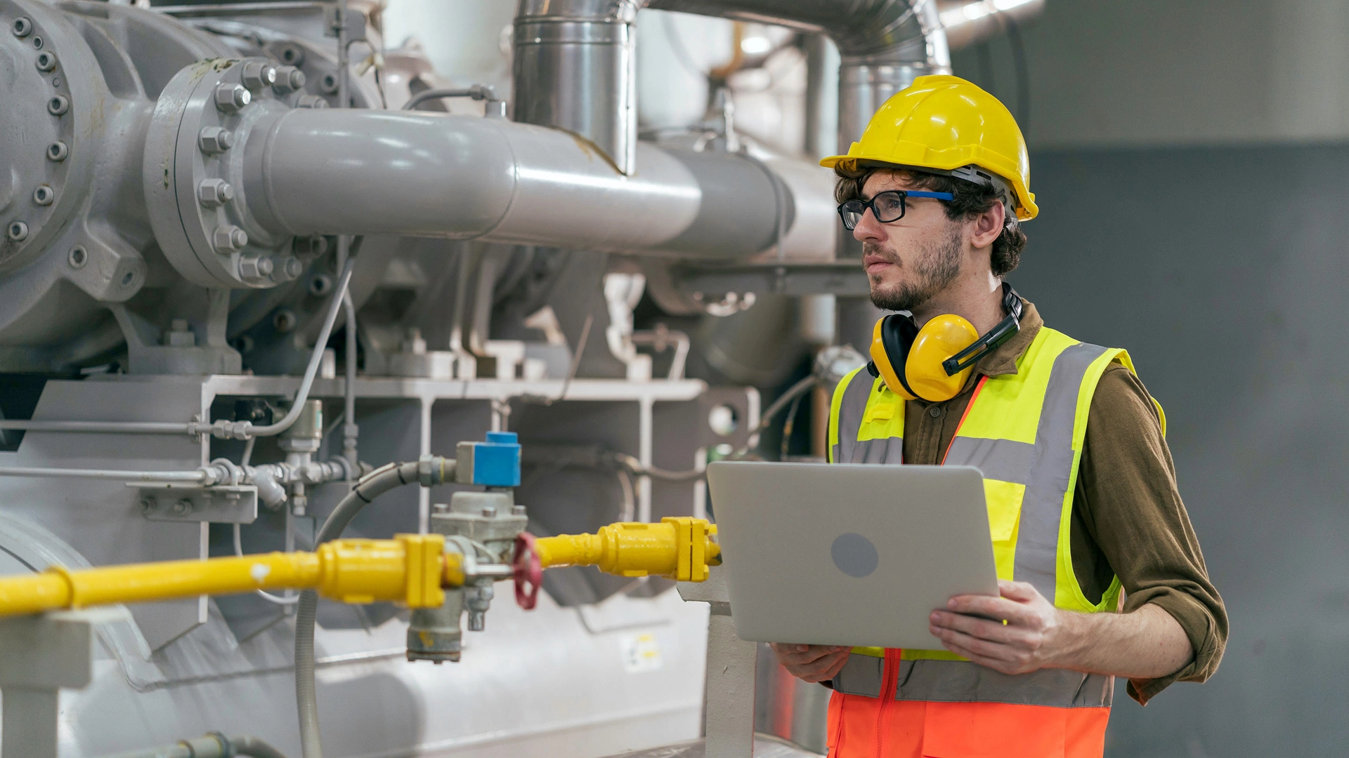 Portrait of HVAC engineer working in boiler room, Engineer working in gas boiler room for steam production of factory industrial manufactured, working in the boiler room, maintenance concept