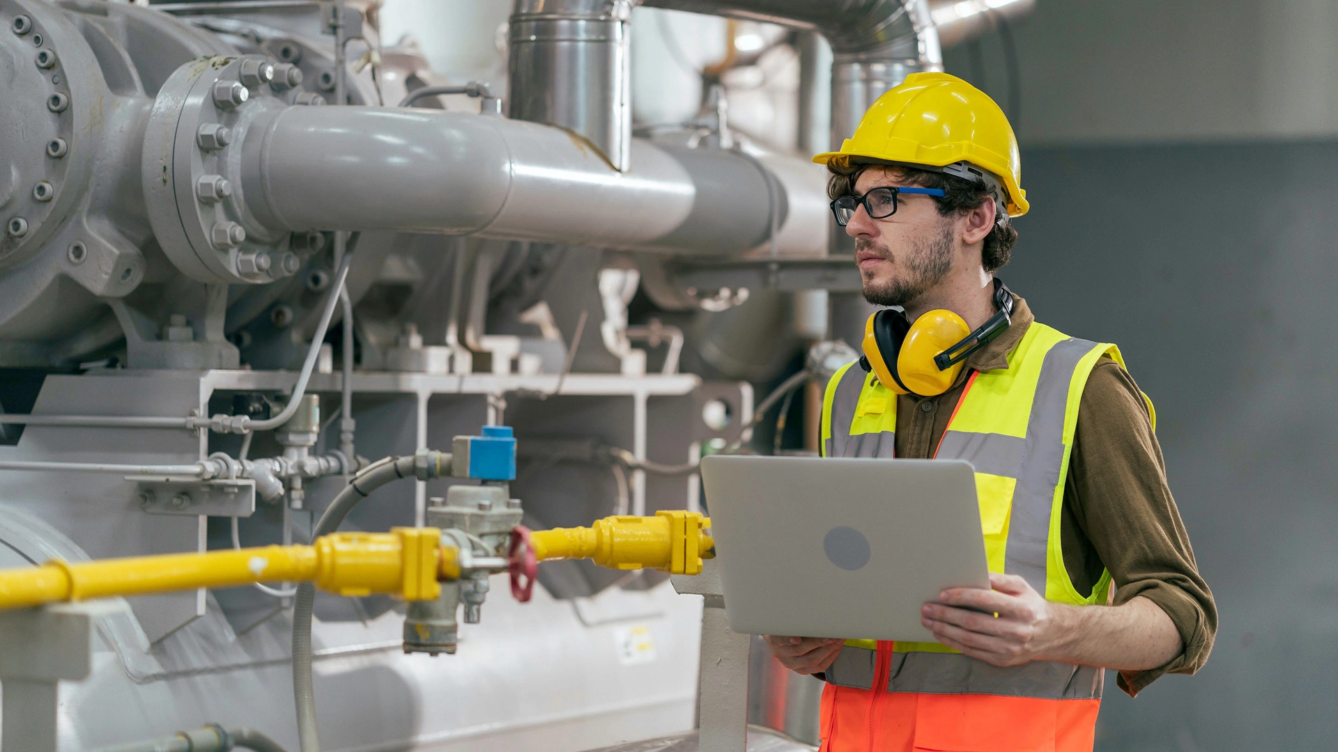 Portrait of HVAC engineer working in boiler room, Engineer working in gas boiler room for steam production of factory industrial manufactured, working in the boiler room, maintenance concept