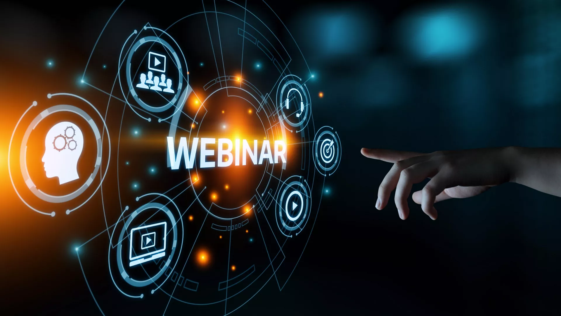 hand touching a hologram with webinar related icons on dark background